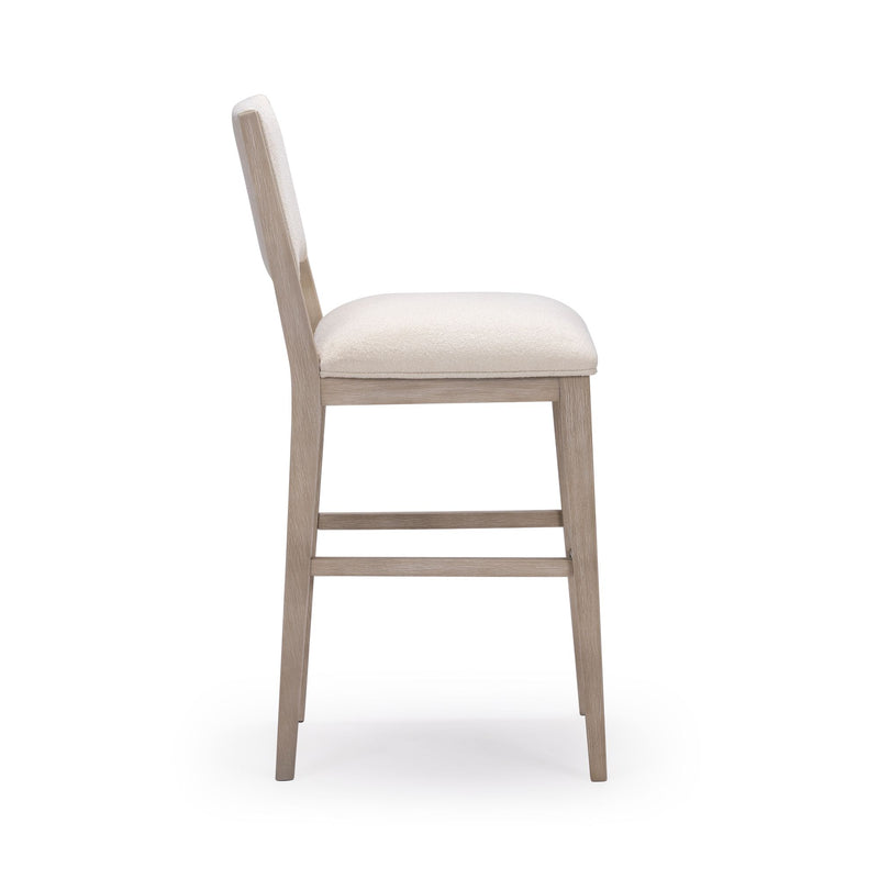 Side view of modern wooden bar stool with cream upholstery, ideal for kitchen islands and dining areas.