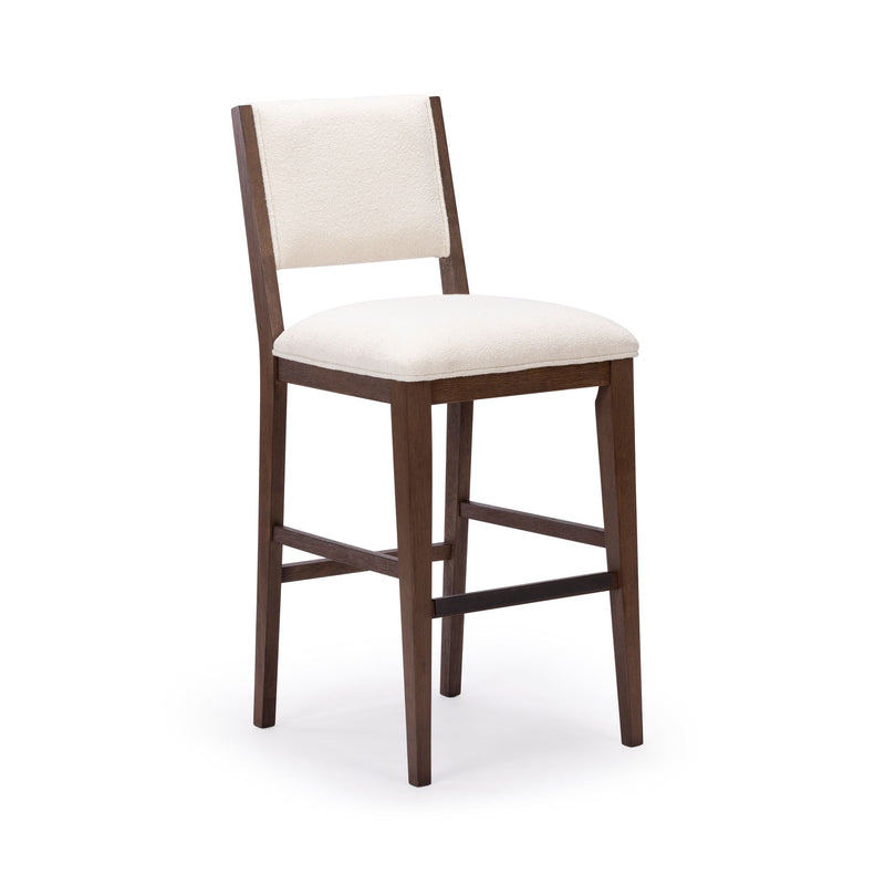 Elegant wooden bar stool with cushioned seat and backrest in cream fabric, ideal for modern kitchen or bar settings.