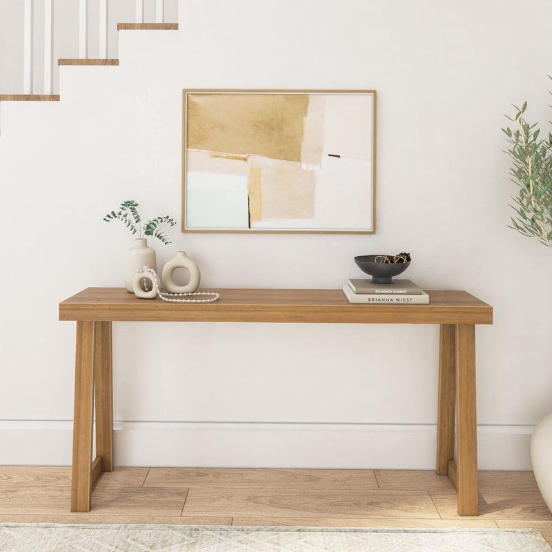 Modern wooden console table with decor and abstract painting in stylish living room.