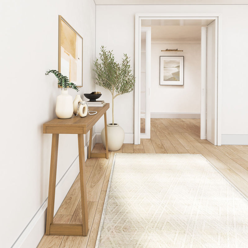 Modern minimalist hallway with wooden console table, decorative vases, and framed artwork.