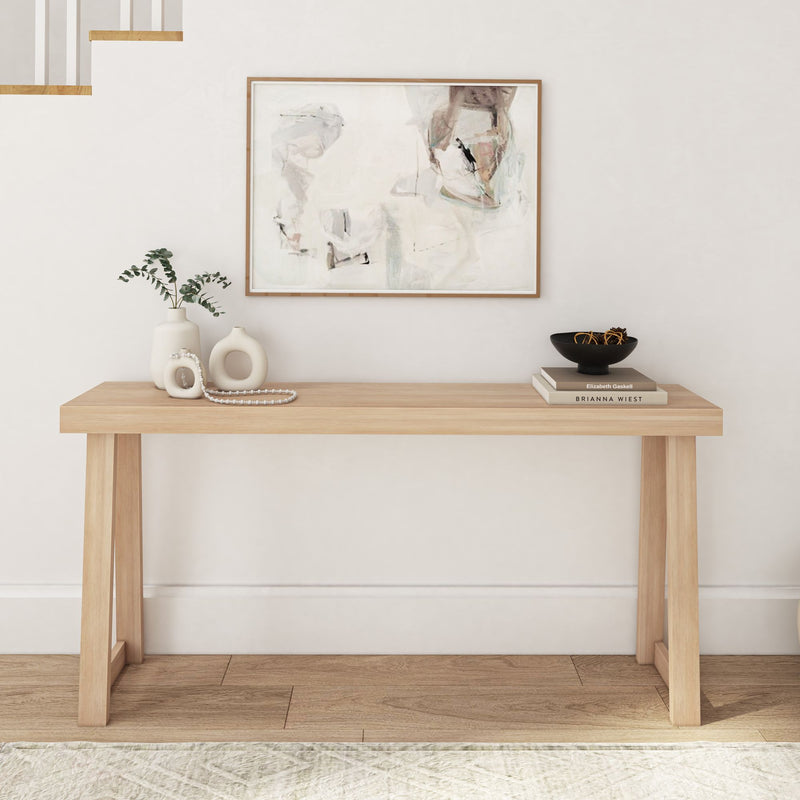 Modern minimalist hallway with wooden console table, abstract art, and decorative vases for home decor inspiration.