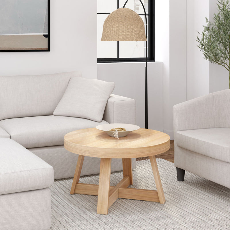 Modern living room with beige couches, wooden coffee table, and floor lamp.