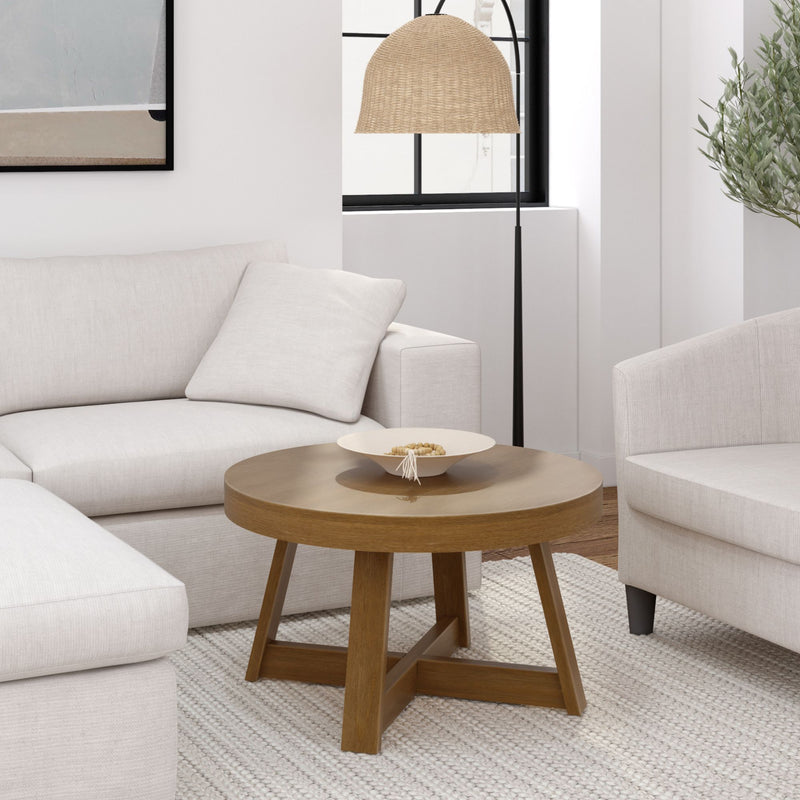 Modern living room with white couch, wooden coffee table, and stylish floor lamp.