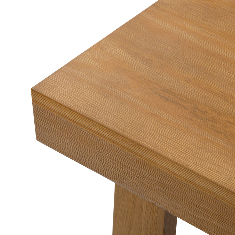 Close-up of a modern wooden table corner with natural finish.