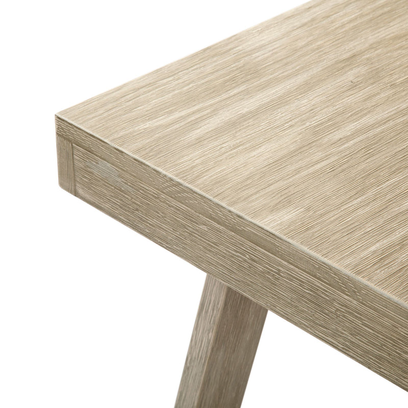 Modern wooden table corner with light oak finish showing grain detail.