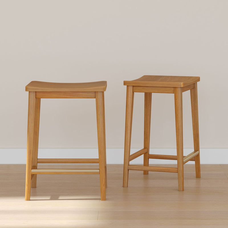 Two wooden bar stools on a light hardwood floor against a neutral wall background.