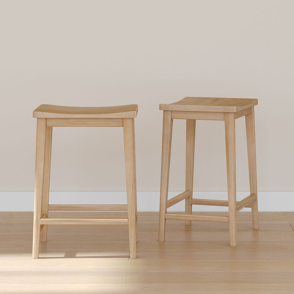 Natural wood bar stools with square seat design on a wooden floor background.