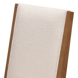 Beige fabric cushioned dining chair with wooden frame detail.