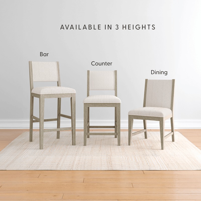 Set of upholstered dining chairs and stools in light wood with neutral beige fabric — bar stool, counter stool, dining chair available in 3 heights