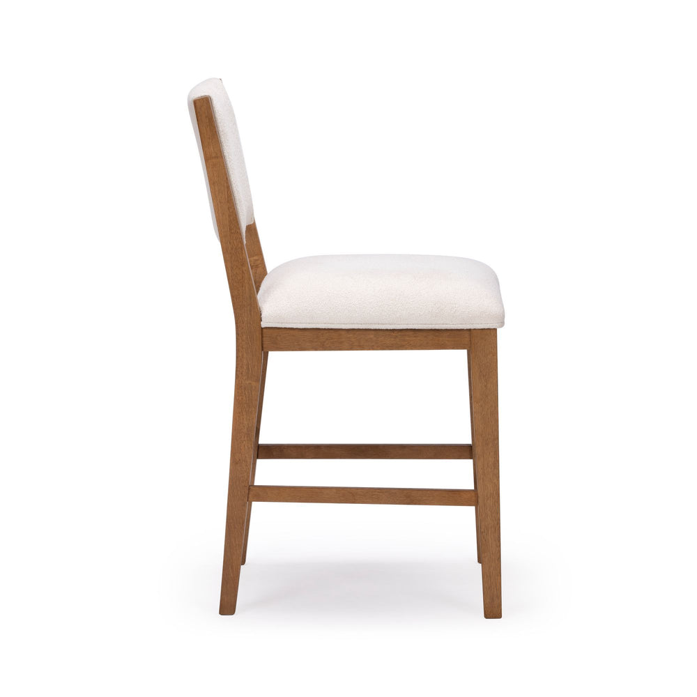 White upholstered wooden dining chair with side view.
