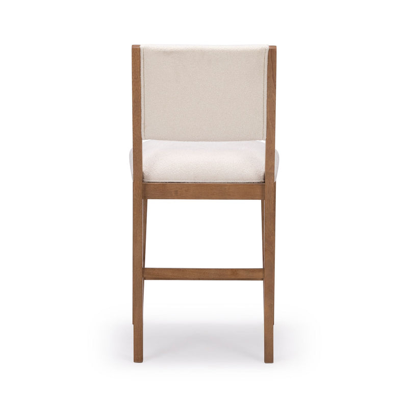Wooden dining chair with white cushioned seat and backrest, viewed from the back against a white background.