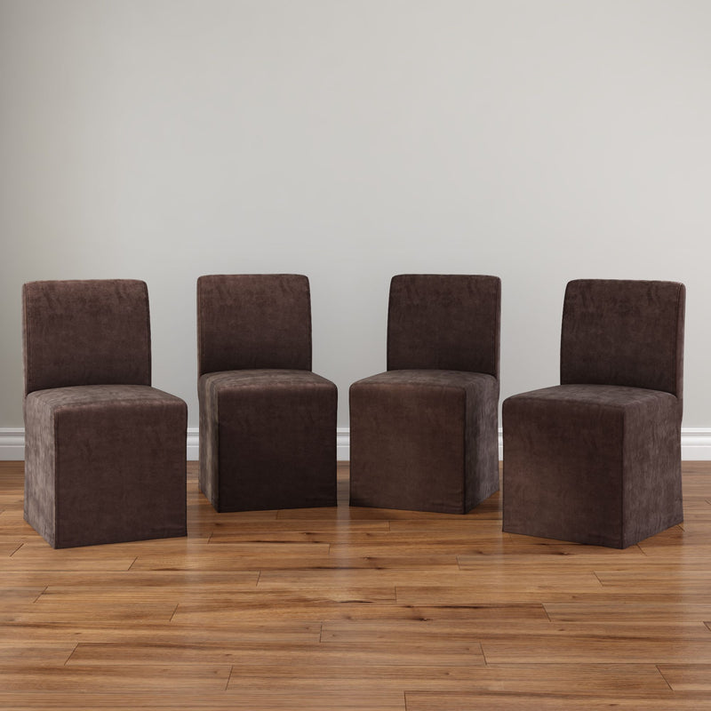 Set of 4 brown upholstered armless dining chairs on hardwood floor against neutral wall, plush microfiber slipcover, minimalist dining room seating