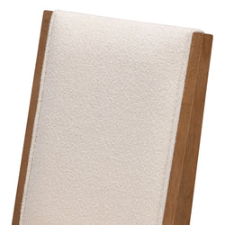 Elegant wooden chair with a soft beige cushioned backrest.