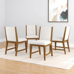 Modern wooden dining chairs with white upholstery in a minimalist room setting.