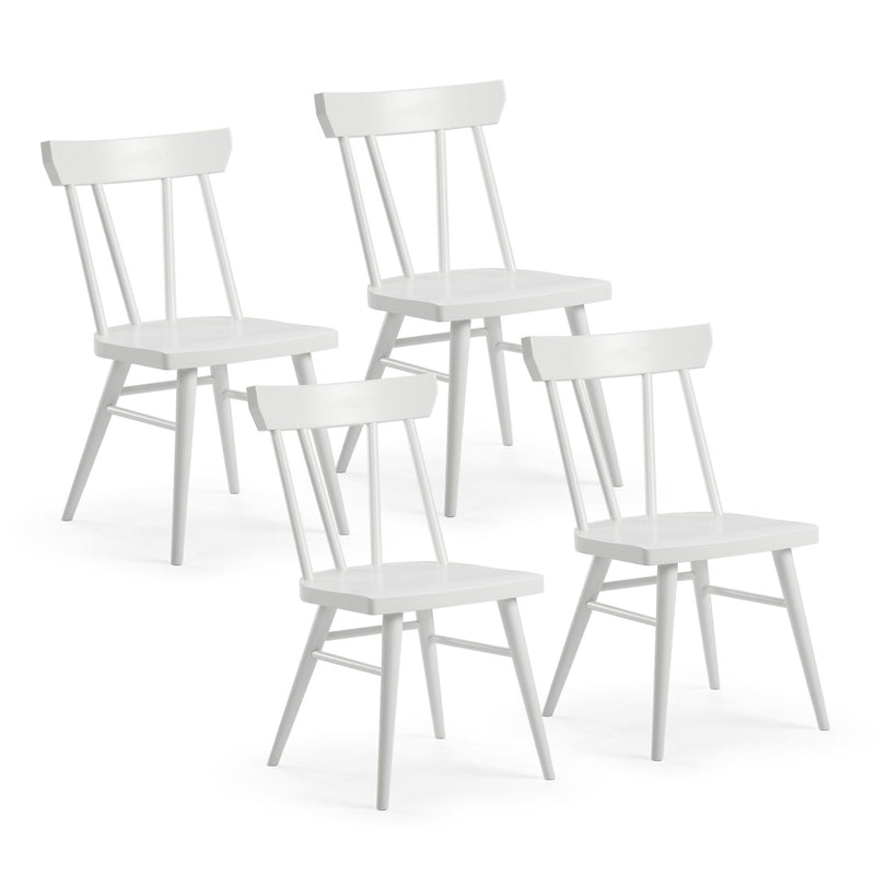 Set of four white wooden dining chairs with spindle back design.