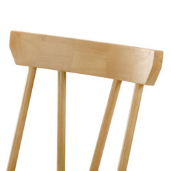 Wooden chair backrest with a natural finish showcasing elegant spindles.