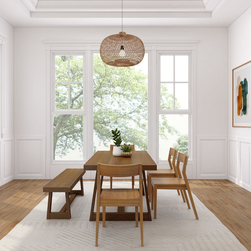 Modern dining room with wooden table, chairs, and large windows overlooking lush greenery.
