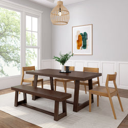 Modern dining room with wooden table, chairs, bench, stylish pendant light, large window, and abstract wall art.