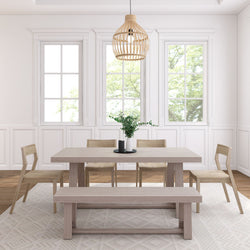 Modern minimalist dining room with light wood furniture, neutral decor, and large windows.