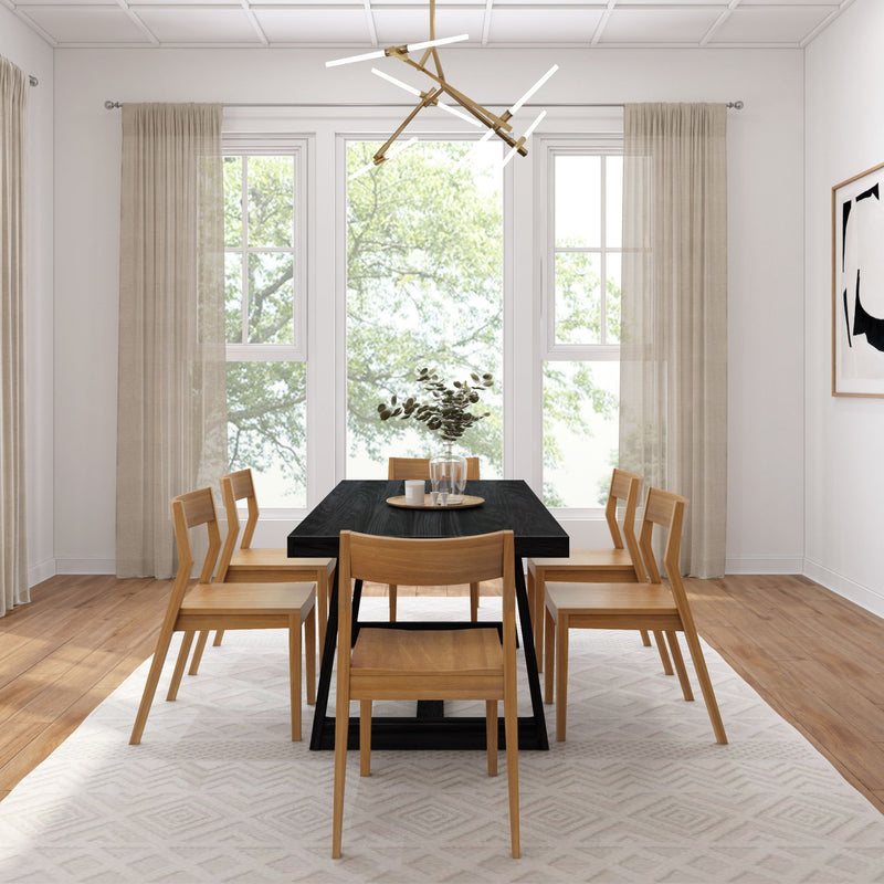 Modern dining room with wooden table, matching chairs, contemporary chandelier, and natural light through large windows.
