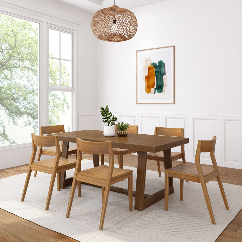 Modern dining room with wooden table and chairs, featuring natural lighting, minimalist decor, and a potted plant centerpiece.