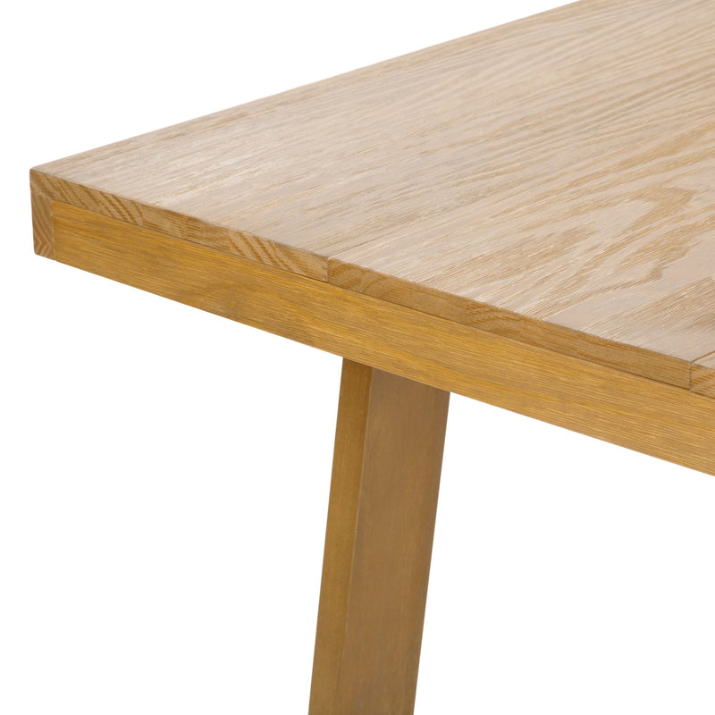 Modern wooden corner desk with sleek design, close-up view.