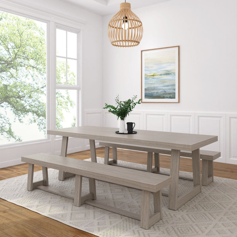 Modern dining room with rustic wooden table and benches, natural light, large window, and stylish pendant lamp.