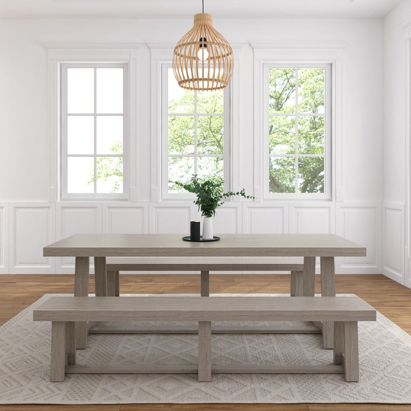 Modern dining room with rustic wooden table, matching benches, and decorative pendant light.