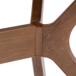 Close-up of wooden chair joint showcasing craftsmanship and natural wood texture.