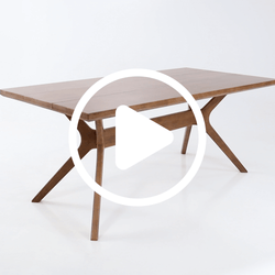 Mid-century modern solid wood dining table with rectangular top and X-shaped trestle legs on white background