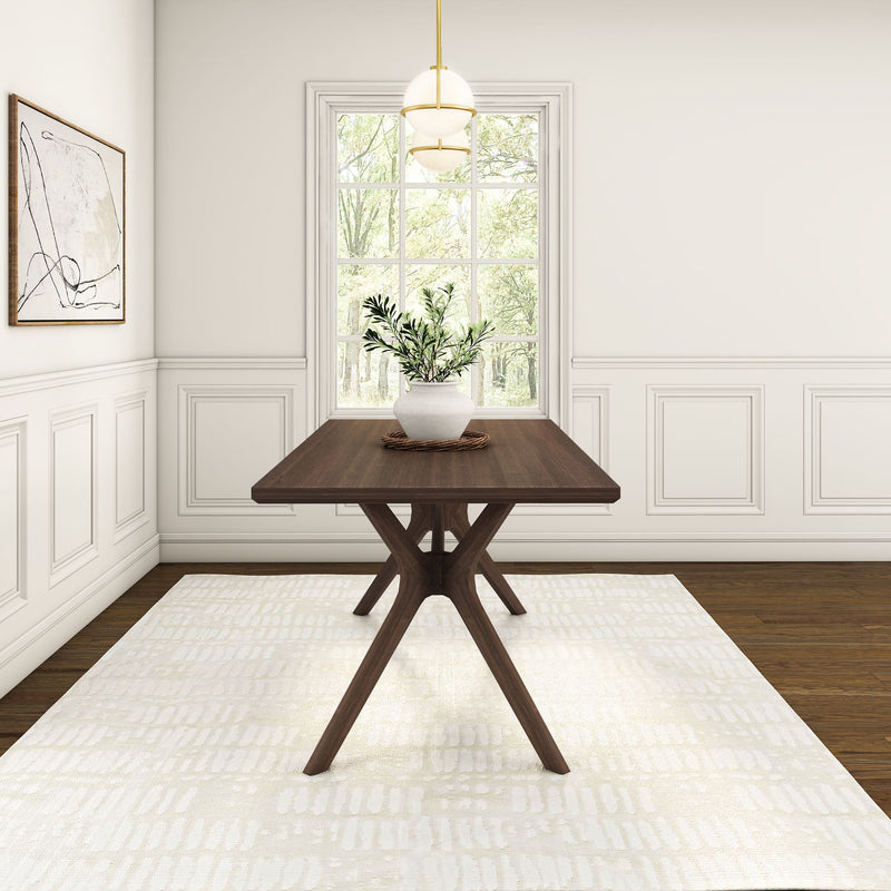 Modern dining room with wooden table and potted plant, featuring elegant white paneling and large window.