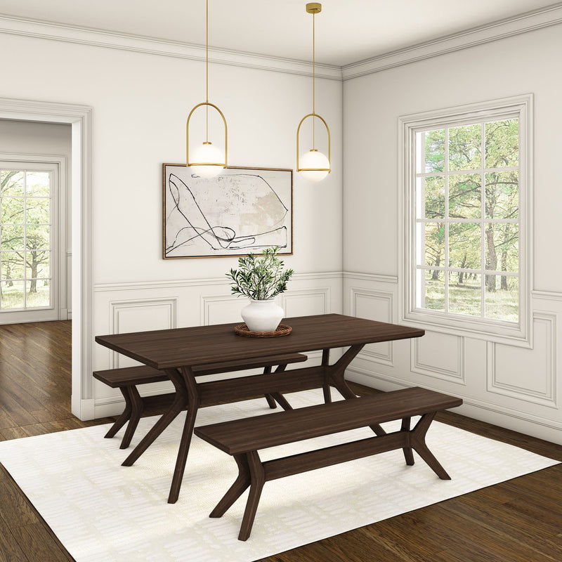 Modern dining room with dark wood table and benches, featuring hanging pendant lights and potted plant centerpiece.