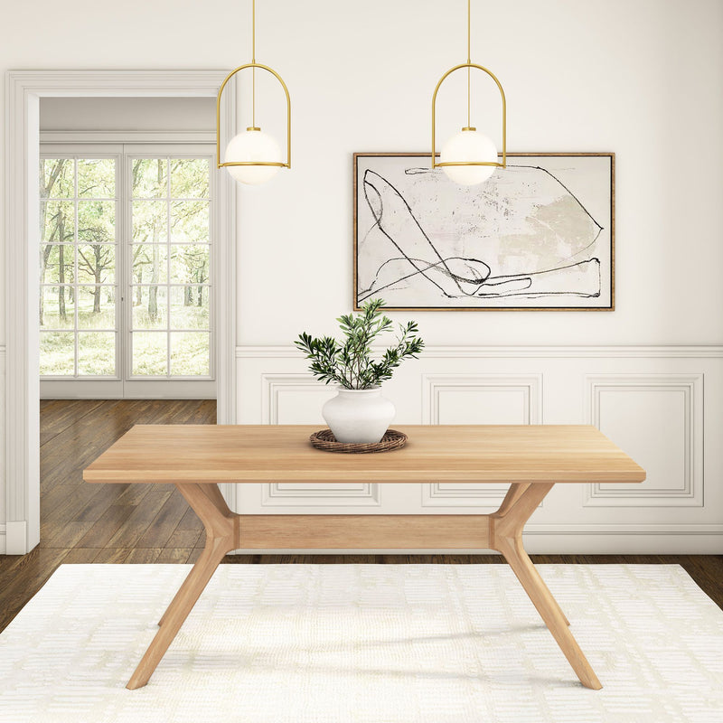 Modern dining room interior with minimalist wooden table, potted plant centerpiece, abstract wall art, and pendant lighting.