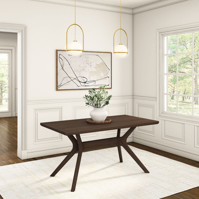 Modern dining room with a dark wooden table, white walls, minimalist wall art, and pendant lighting.
