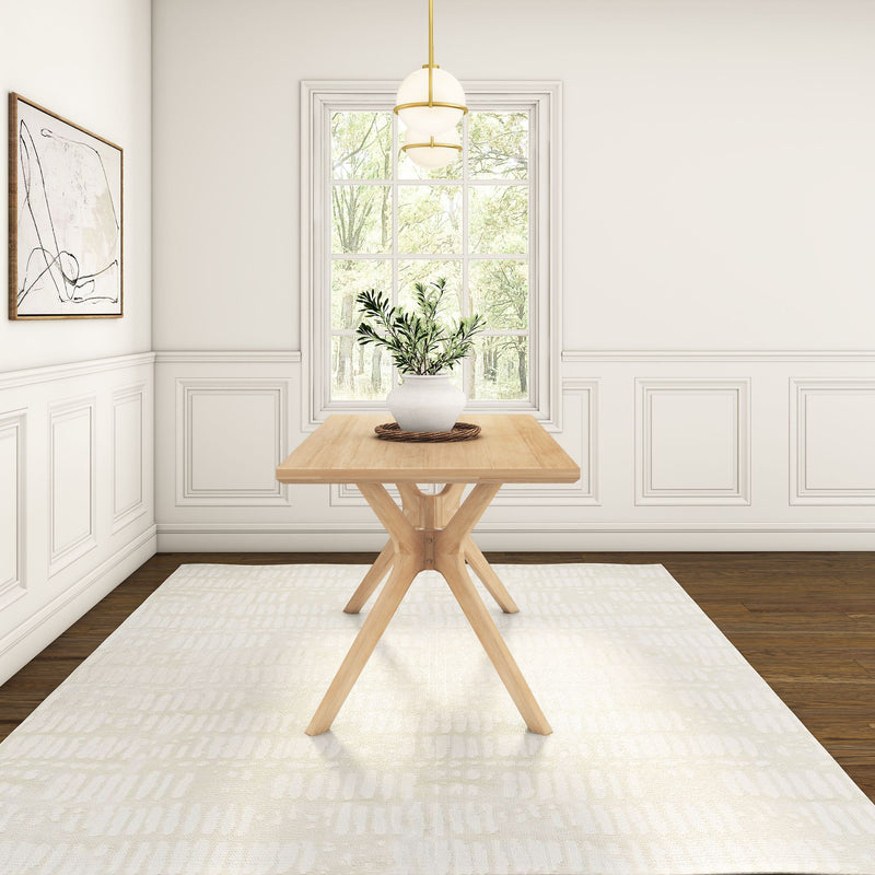 Minimalist dining room with a wooden table, potted plant centerpiece, large window, and modern decor.