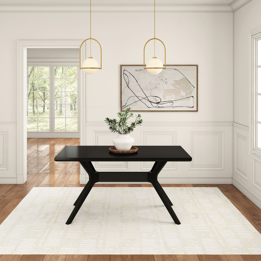 Modern dining room with black table and minimalist decor featuring a plant centerpiece and abstract artwork.