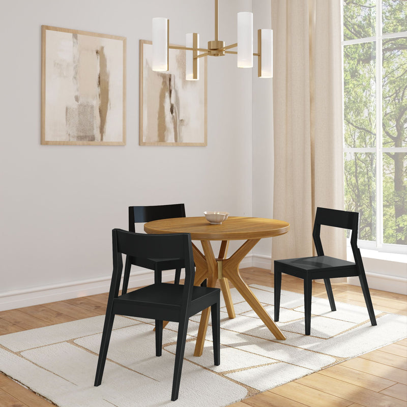 Modern dining room with wooden table, black chairs, abstract wall art, and white rug.