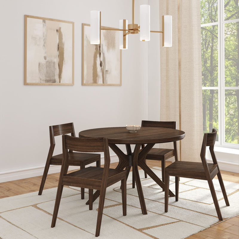 Modern dining room with round wooden table and chairs, abstract wall art, and elegant chandelier.