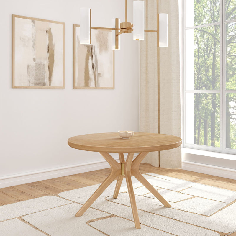 Modern minimalist dining room with round wooden table, abstract wall art, and geometric chandelier.