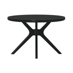 Modern black round dining table with matte top and sculptural pedestal metal base featuring angled legs