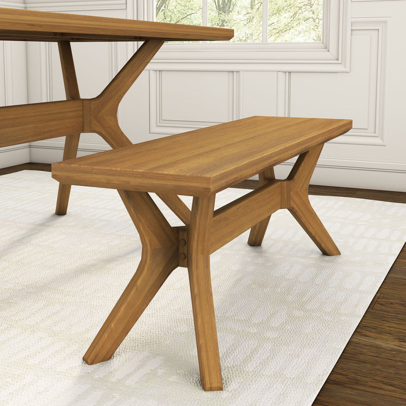 Wooden dining bench with cross-legged design in modern living room.