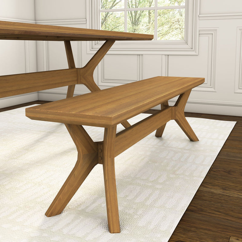 Modern wooden dining bench with cross-leg design in bright room, perfect for kitchen or dining area seating.