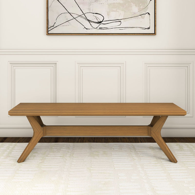 Mid-century modern wooden bench with unique leg design in a minimalist living room setting.