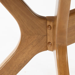 Close-up of a wooden chair joint showcasing craftsmanship and design detailing.