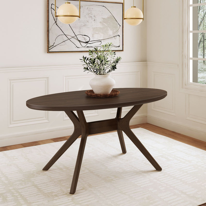 Elegant oval wooden dining table in a modern room with white paneled walls and abstract artwork.