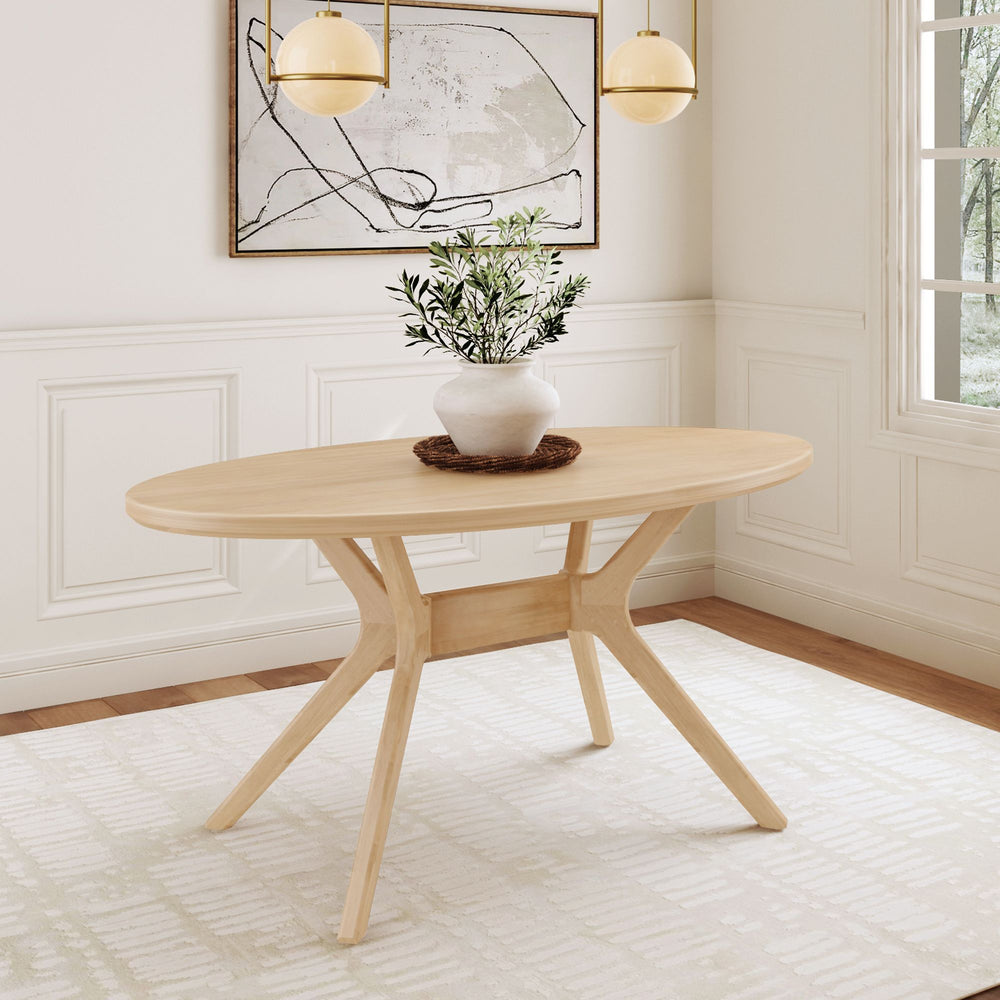 Modern oval wooden dining table with elegant decor in a bright, styled room.