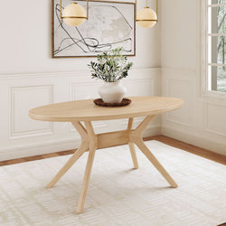 Modern oval wooden dining table with elegant decor in a bright, styled room.