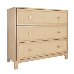 Light oak three-drawer dresser with woven cane rattan drawer fronts and brass knobs, natural wood finish coastal boho bedroom storage chest