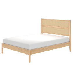 Light oak platform bed with woven rattan cane headboard and white mattress, Scandinavian mid-century modern minimalist style