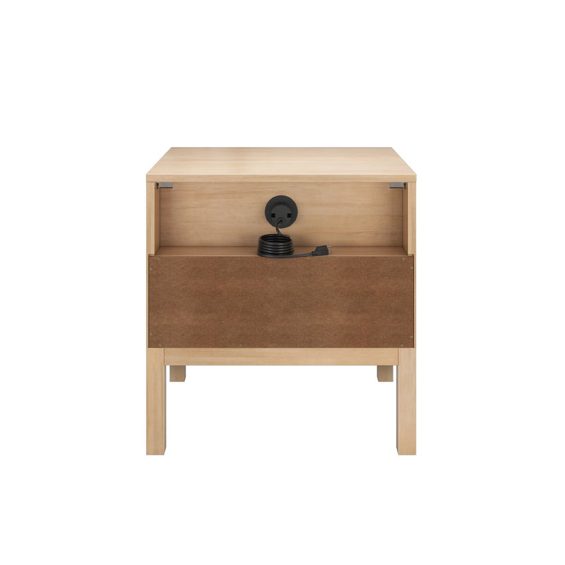 Light oak wooden bedside table with open storage, built-in cable management and coiled black power cord on white background